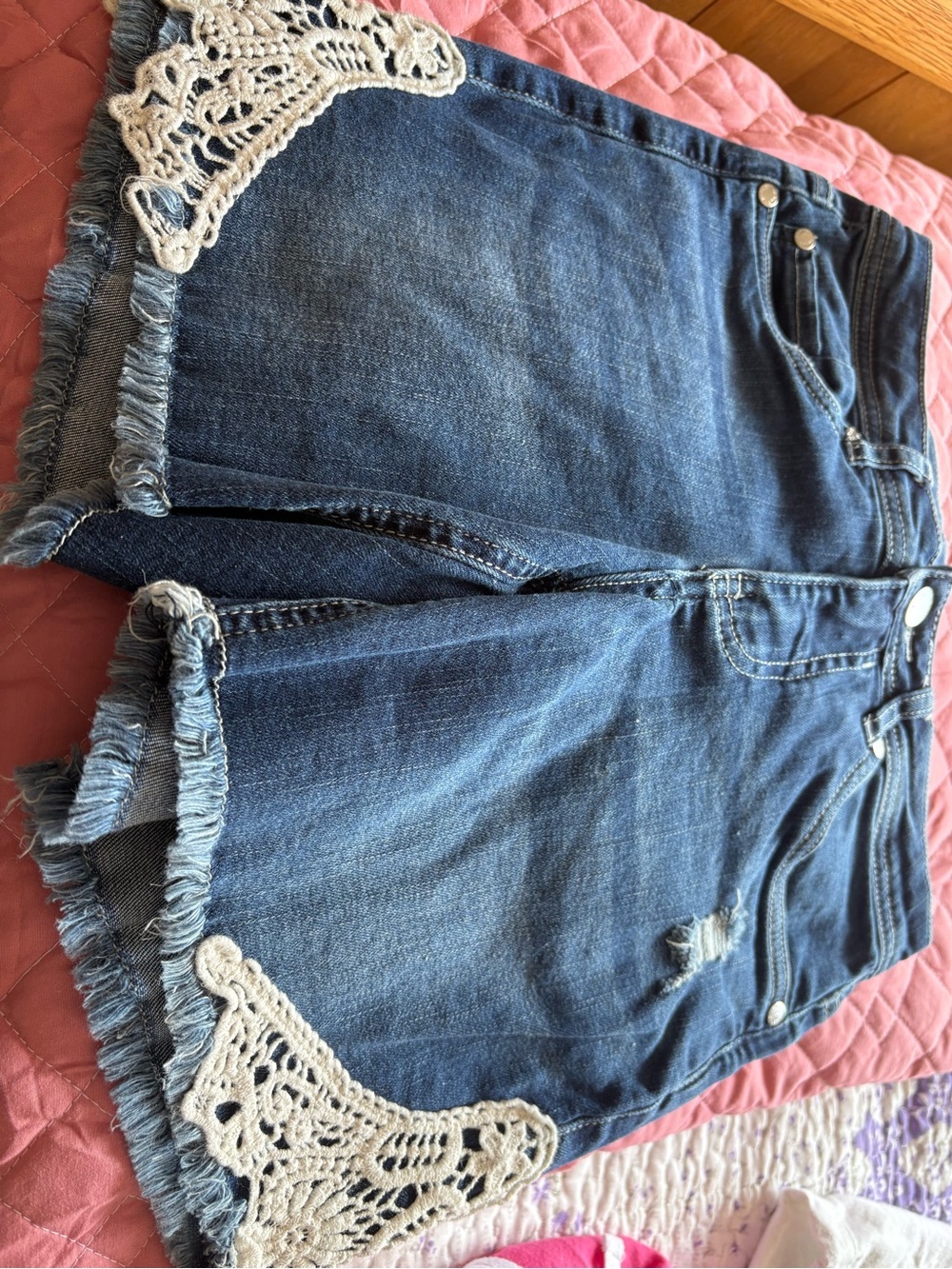 American Eagle Outfitters Jean shorts with lace bottom on each side.